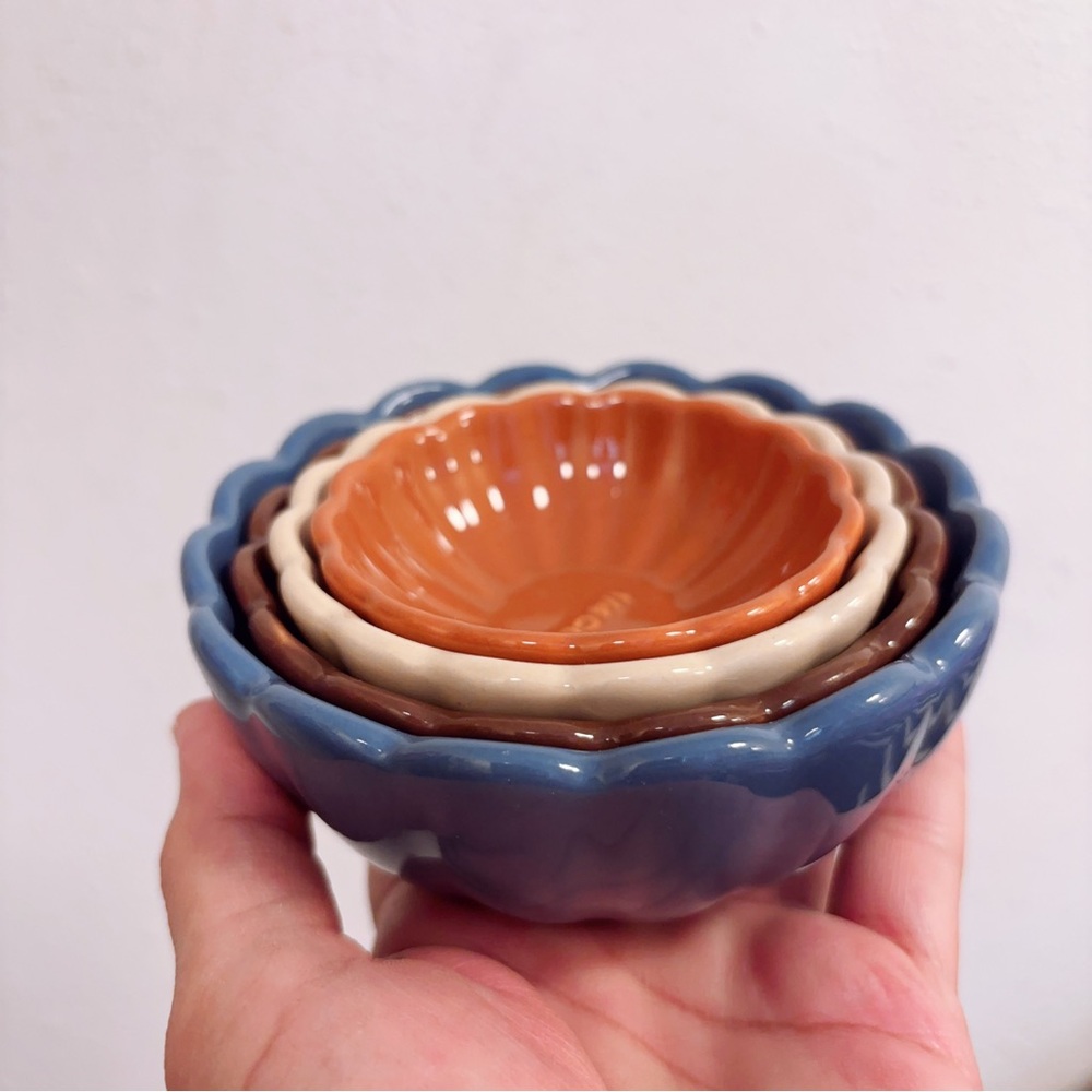 Stackable Ceramic Nesting Measuring Cups in Blue, Brown, Cream, and Orange